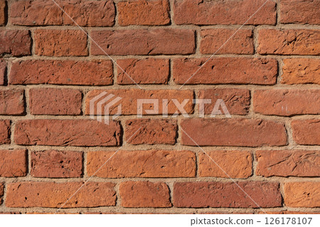 Empty brick red wall. background of a old brick house. Empty brick red wall. background of a old brick house. 126178107