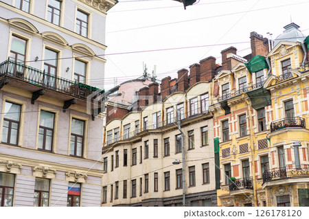 Minimalist architecture building facade of old historic house exterior. Decorative ornamental design elements of classic European style apartment building front view in Saint Petersburg, Russia 126178120