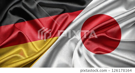 Waving German and Japanese Flags Symbolizing International Friendship and Unity Waving German and Japanese Flags Symbolizing International Friendship and Unity 126178164