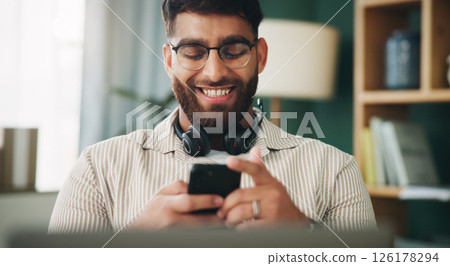 Home, man and laptop with smartphone for chat, reading and freelancer for call center. Office, headset and consultant with technology on break, social media and remote work for telemarketing in house 126178294