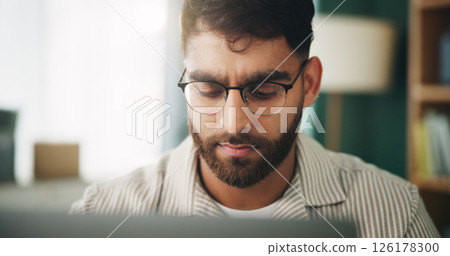 Home, man and freelancer with laptop for reading, solution and online story for publication. House, remote work and content writer with tech for research, problem solving of article website in office 126178300