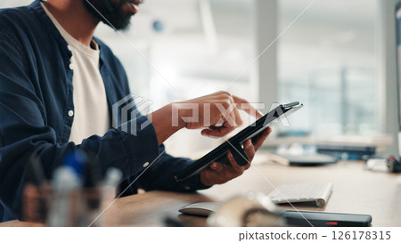 Businessman, hands and tablet in office for research, project planning and scroll on networking platform. Employee, tech and typing at desk for communication, email draft or browsing for productivity Businessman, hands and tablet in office for research, project planning and scroll on networking platform. Employee, tech and typing at desk for communication, email draft or browsing for productivity 126178315