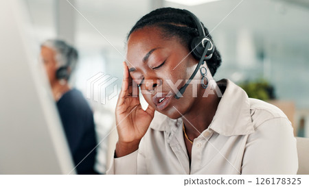 Frustrated woman, consultant and stress with headset for call center, difficult customer or error. Female person, agent or employee with headache or anxiety for mistake, pressure or fatigue at office 126178325