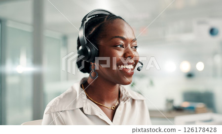 Happy, black woman and consultant with headset at call center for online communication or customer service. Female person, agent or smile with technology, mic or help for virtual assistance at office 126178428