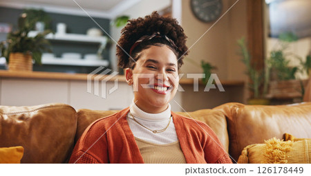 Portrait, home and woman on sofa, smile and confident personality with weekend break in living room. Face, apartment and happy person on couch, relaxing and enjoyment with pride, calm and mindset 126178449