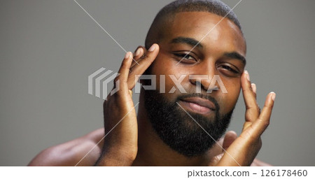 Facial, skincare and portrait of black man in studio for salon, grooming and dermatology. Cosmetics, glow and self care with person and beauty on gray background for hydration, hygiene and shine 126178460