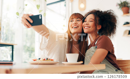 Selfie, hug and women in coffee shop, relax and photography for memory of reunion and social media. Bonding, friends and people with happiness in cafe, profile picture and break for influencer Selfie, hug and women in coffee shop, relax and photography for memory of reunion and social media. Bonding, friends and people with happiness in cafe, profile picture and break for influencer 126178509