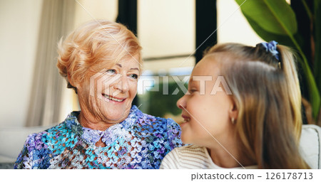 Bonding, family or love with grandmother and grandchild on sofa in living room of retirement home for visit. Happy, relax or smile with girl and old woman in apartment for weekend conversation Bonding, family or love with grandmother and grandchild on sofa in living room of retirement home for visit. Happy, relax or smile with girl and old woman in apartment for weekend conversation 126178713