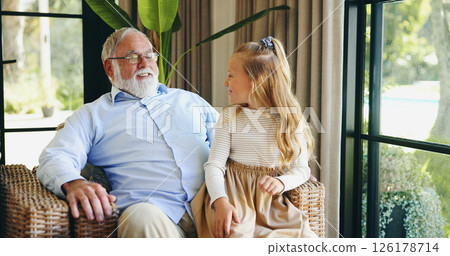 Family, grandpa and bonding with grandchild, house and conversation with senior man in living room. Home, elderly person and talking to granddaughter in lounge, relax and happy grandfather with kid 126178714