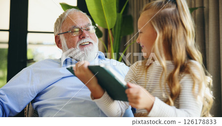 Relax, grandfather and child with tablet in home for educational online video, cartoon app or weekend visit. Love, old man and happy girl with digital tech for gaming subscription or bonding together Relax, grandfather and child with tablet in home for educational online video, cartoon app or weekend visit. Love, old man and happy girl with digital tech for gaming subscription or bonding together 126178833