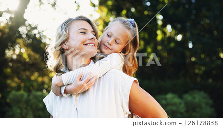 Outdoor, mother and child with piggyback for bonding together, relationship and connection in park. Happy family, mom and girl with parent for carrying, love and care with trust on weekend holiday Outdoor, mother and child with piggyback for bonding together, relationship and connection in park. Happy family, mom and girl with parent for carrying, love and care with trust on weekend holiday 126178838