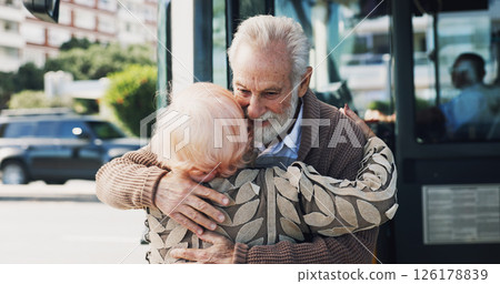 Senior couple, hug and travel in city for greeting, reunion and journey for visit at bus stop. Elderly people, passenger and embrace for commute of public transport, parting gesture and farewell trip 126178839