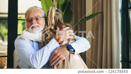 Home, hug and grandpa with child, welcome and happy for visit, bonding and senior man with granddaughter. Family, elderly person and embrace with girl in house, care and smile with kid in living room Home, hug and grandpa with child, welcome and happy for visit, bonding and senior man with granddaughter. Family, elderly person and embrace with girl in house, care and smile with kid in living room 126178850