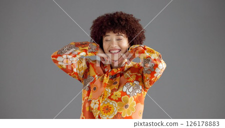 Girl, happy and retro fashion in studio for aesthetic outfit, vintage style and confident personality. Mockup space, woman and smile with floral shirt on gray background for pride or colorful clothes 126178883