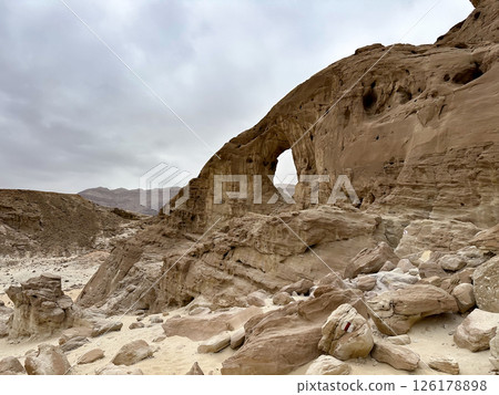 An arch formed by erosion and weathering in Timna Park in the Arava desert 126178898
