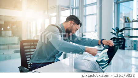 Business, man and punch laptop in office for bad news, pc glitch and frustrated for proposal fail. Angry, male person and violence with tech for software error, property vandalism and mistake tantrum 126179028
