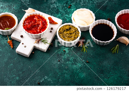 Set of different sauces. Ketchup, mustard, pesto Set of different sauces. Ketchup, mustard, pesto 126179217