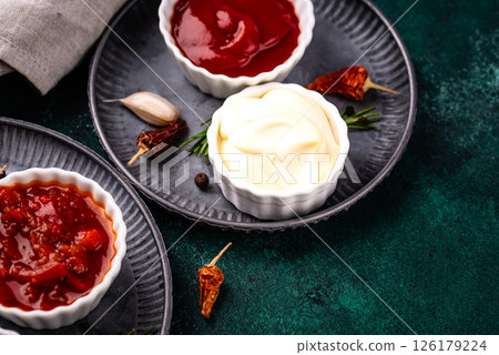 Set of different sauces. Ketchup, mustard, pesto Set of different sauces. Ketchup, mustard, pesto 126179224