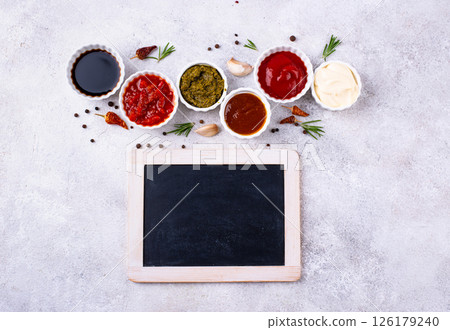 Set of different sauces. Ketchup, mustard, pesto 126179240
