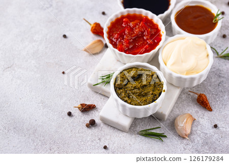 Set of different sauces. Ketchup, mustard, pesto 126179284