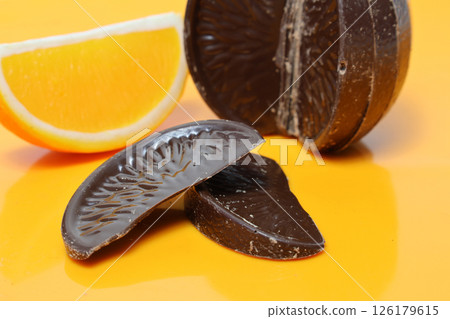 Orange chocolate on an orange background 126179615