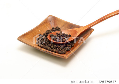 Black pepper on white background 126179617