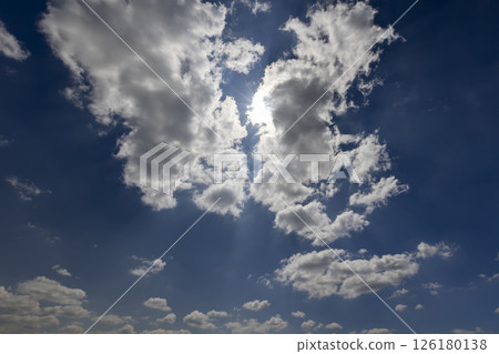 beautiful blue sky with lush white clouds in sunny bright weather 126180138