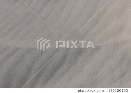 fabric used for the production of clothing, the details of a piece of clothing made of eco friendly and safe fabric, close up fabric used for the production of clothing, the details of a piece of clothing made of eco friendly and safe fabric, close up 126180160
