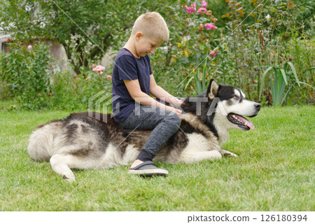 A boy with a dog 126180394