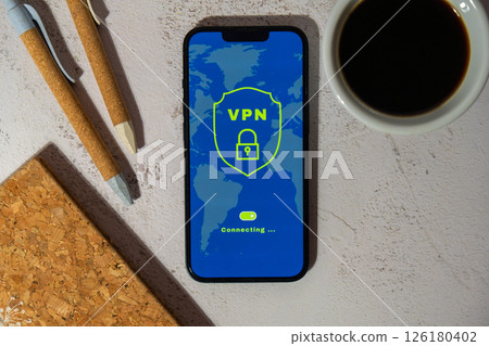 Mobile phone App screen of VPN creation Internet protocols for protection private network Virtual private network anonymous safe and secure internet access on smartphone on workplace background with 126180402