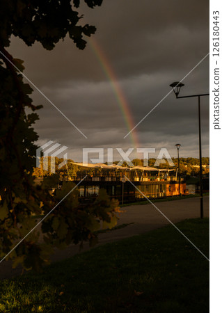 Heavy rain and rainbow above the Vistula river in Krakow Poland. Stunning views of the city rainy season and rainbow Heavy rain and rainbow above the Vistula river in Krakow Poland. Stunning views of the city rainy season and rainbow 126180443