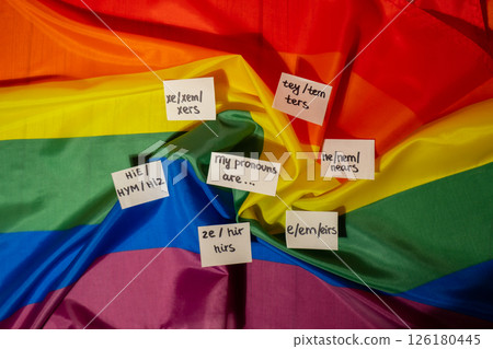 MY PRONOUNS ARE Neo pronouns concept. Rainbow flag with paper notes text gender pronouns hie, e, ne, xe, ze, tey. Non-binary people rights transgenders. Lgbtq community support assume my gender 126180445