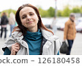 Brunette woman portrait on the street 126180458