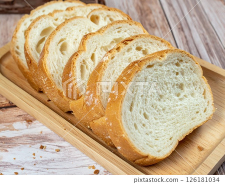 Five Slices of Bread on a Wooden Board Five Slices of Bread on a Wooden Board 126181034