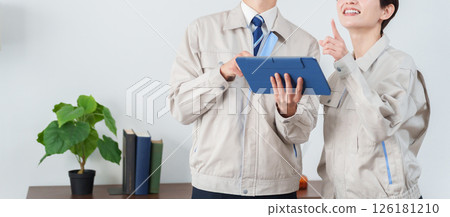 Contractor in work clothes inspecting 126181210