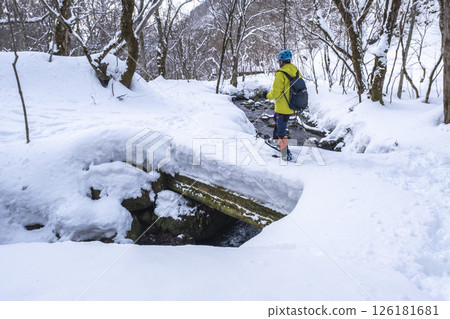 Image of enjoying fresh snow in the forest on snowshoes Oyamakiyazawa mountain stream 126181681