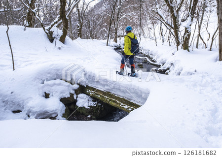Image of enjoying fresh snow in the forest on snowshoes Oyamakiyazawa mountain stream 126181682