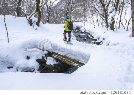 Image of enjoying fresh snow in the forest on snowshoes Oyamakiyazawa mountain stream 126181683