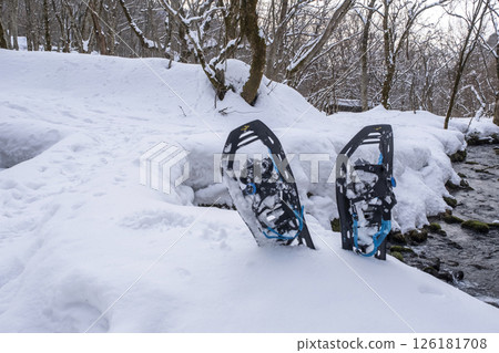 Image of enjoying fresh snow in the forest on snowshoes Oyamakiyazawa mountain stream Image of enjoying fresh snow in the forest on snowshoes Oyamakiyazawa mountain stream 126181708