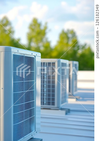 External HVAC units mounted on commercial rooftops highlight urban design and functionality 126182349