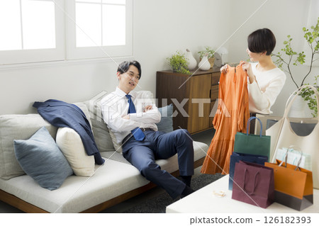 A woman returning home from shopping 126182393