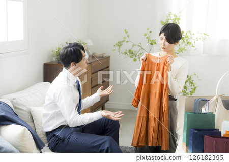 A woman returning home from shopping A woman returning home from shopping 126182395