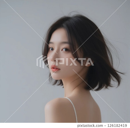 Portrait of a Japanese woman looking back on white background 126182419