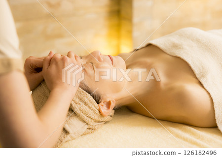 Senior woman receiving massage at beauty salon Senior woman receiving massage at beauty salon 126182496