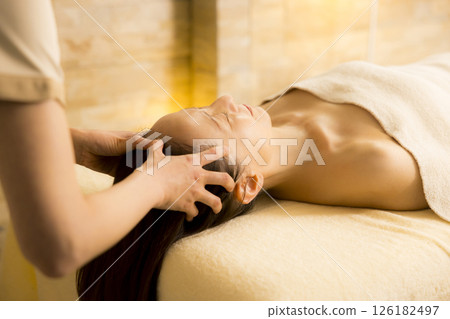 Senior woman receiving massage at beauty salon Senior woman receiving massage at beauty salon 126182497