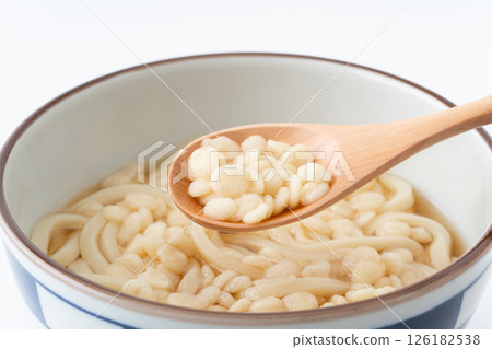 Close-up of udon tempura flakes on a spoon Close-up of udon tempura flakes on a spoon 126182538