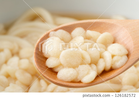 Close-up of udon tempura flakes on a spoon Close-up of udon tempura flakes on a spoon 126182572