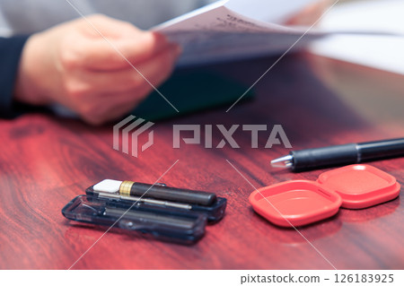 A housewife carefully reading the contract A housewife carefully reading the contract 126183925
