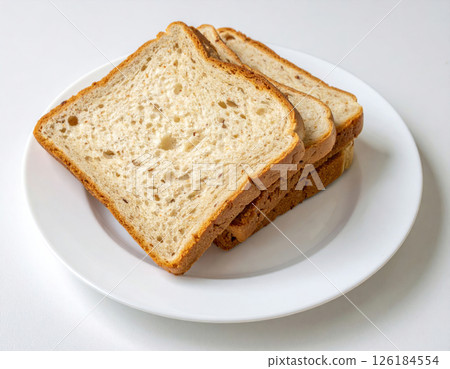 Soft White Bread Slices Stacked on a Plate Soft White Bread Slices Stacked on a Plate 126184554