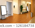 Digital signage with a white display installed in a waiting area of a hospital or clinic 126184738